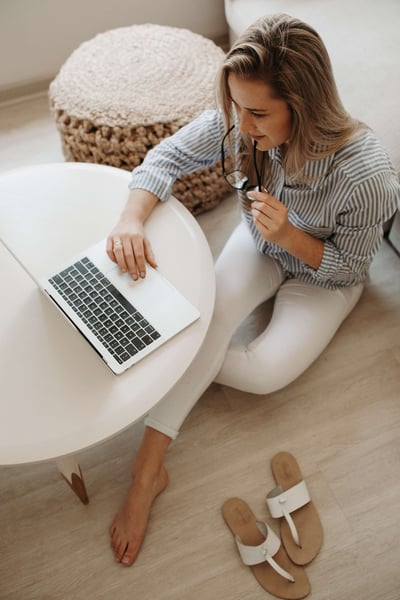 Woman Sitting Comfortably at table working from home